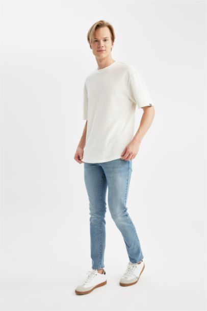 بنطرون جينز كارلو سكيني فيت بخصر عادي