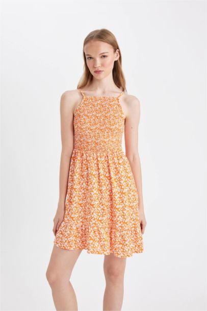 Mini Robe fleurie à bretelles et col licou