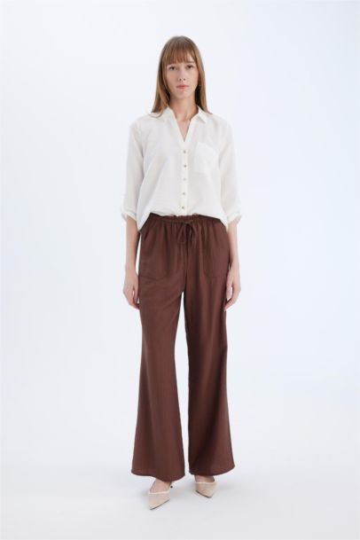 Pantalon large à taille haute avec poches