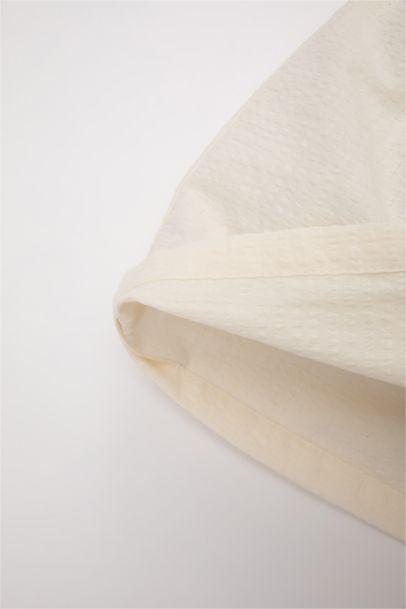 قميص بناتي نص ردن ذو مظهر كتان