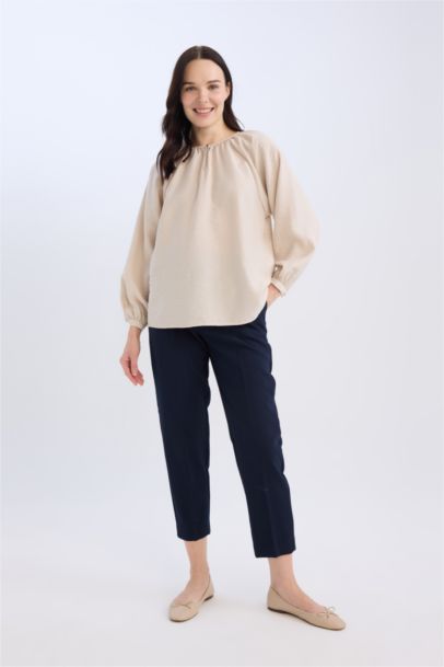 Blouse longue à col rond avec détails de boutons pour femme