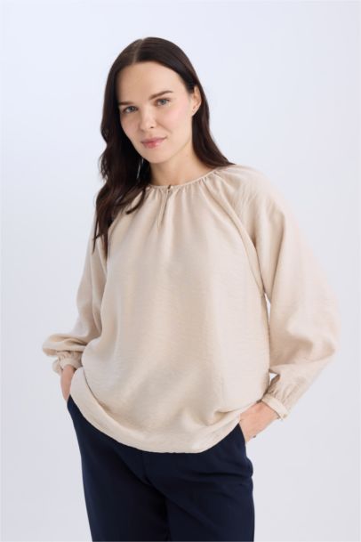 Blouse longue à col rond avec détails de boutons pour femme