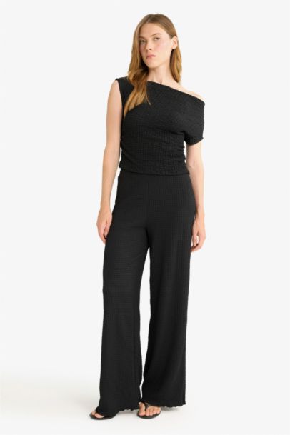 Pantalon à jambes larges et plissées