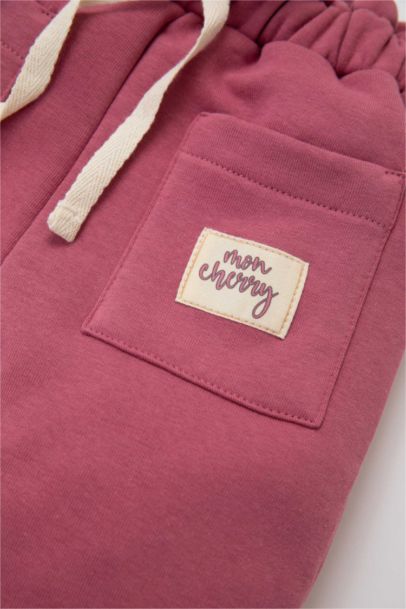 Jogging avec poche et étiquette tissée pour bébé Fille