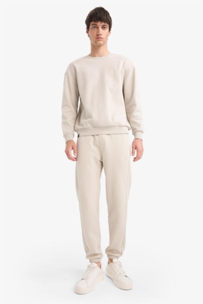 Pantalon de survêtement slim fit en piqué à poches zippées