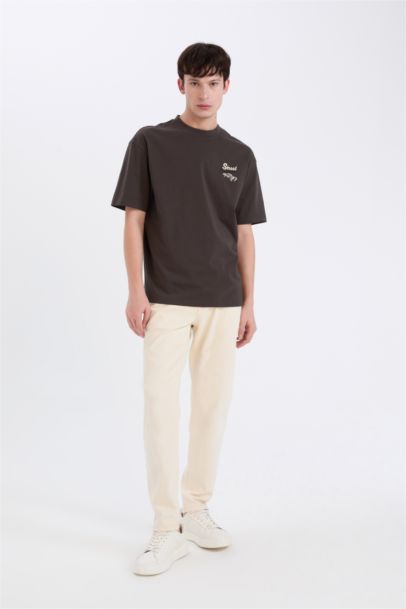 %100 Pamuk Boxy Fit Bisiklet Yaka Sırt Baskılı Kısa Kollu Tişört