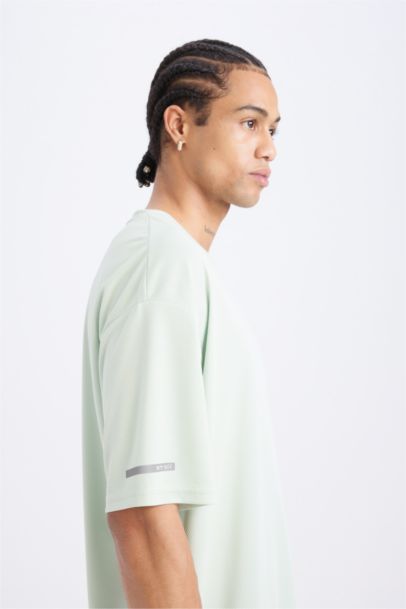 تيشيرت رياضي نص كم أوفر سايز  من DeFactoFit