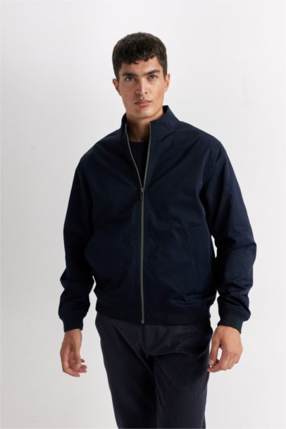 Veste slim zippée à col montant