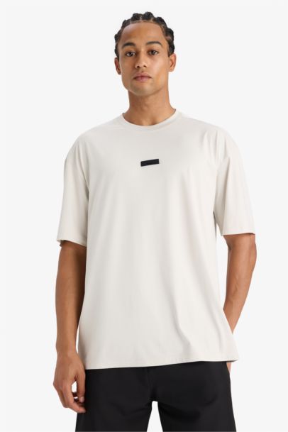 تيشيرت رياضي نص ردن أوفر سايز بياخة مستديرة من DeFactoFit