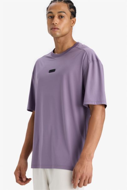 تيشيرت رياضي نص ردن أوفر سايز بياخة مستديرة من DeFactoFit