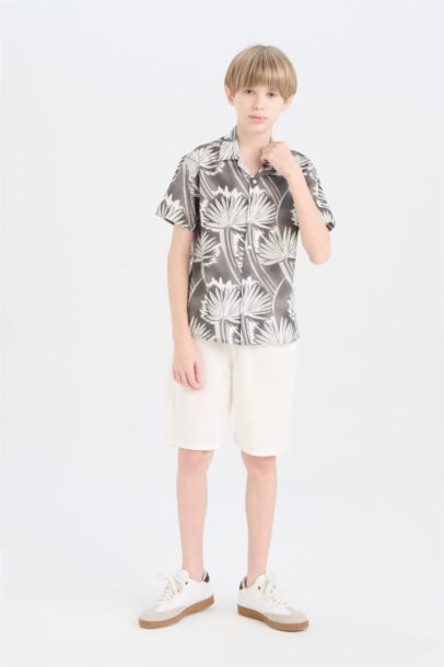 قميص بولو اولادي رمادي نص كم اوفر سايز