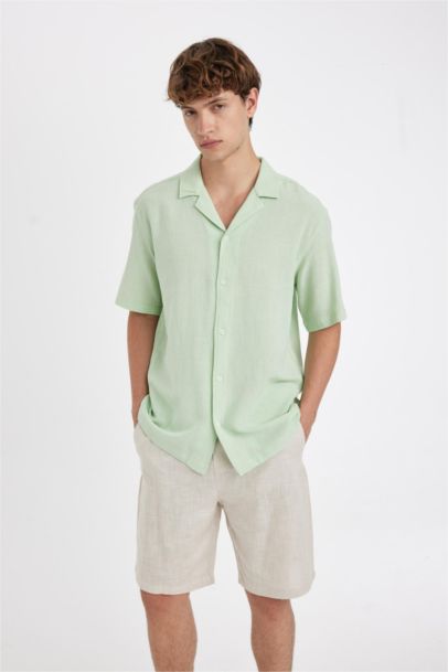 قميص قطن قصة مريحة بياخة عالية