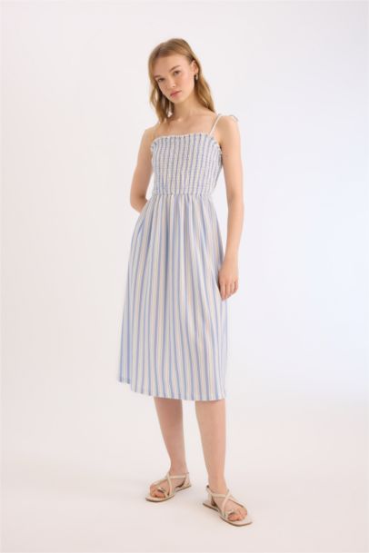 فستان نص كم ميدي مخطط بحمالات