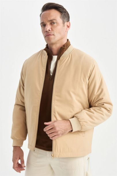 جاكيت بومبر خفيف قصة عادية طارد للماء وياخة كوليج