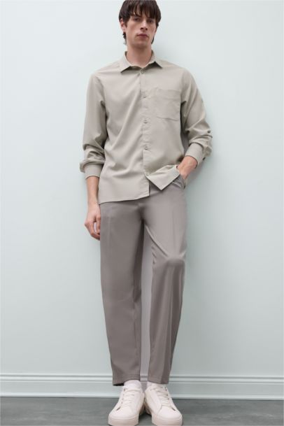 قميص بولو كم طويل قصة عادية