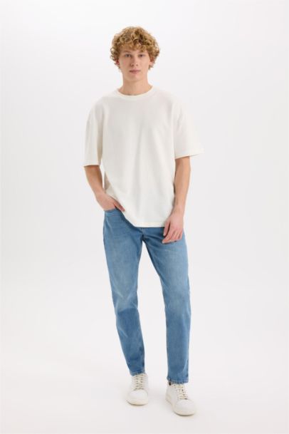 سروال جينز جينز بساق ضيق