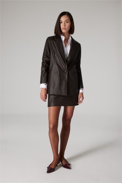 تنورة قصيرة جلد صناعي قصة A بخصر عالي