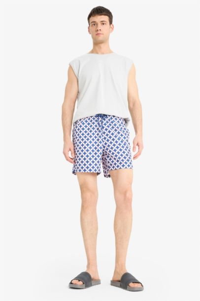 Short de bain court imprimé avec doublure en filet