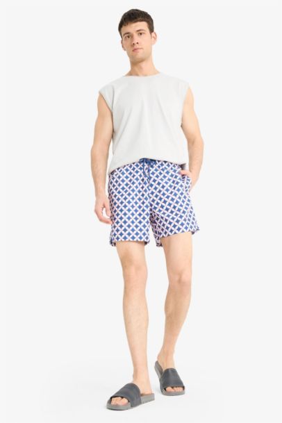 Short de bain court imprimé avec doublure en filet