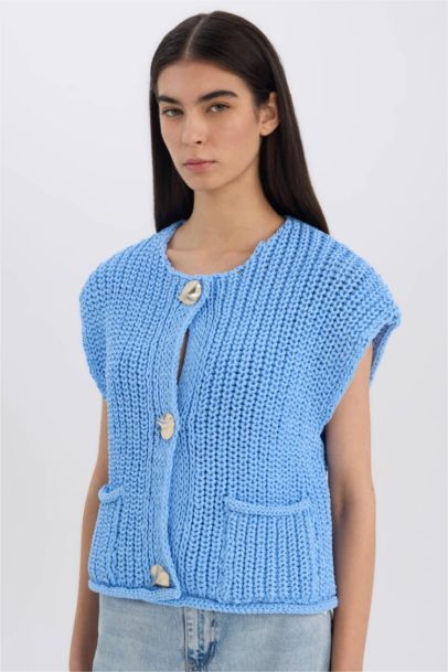 Pull en tricot sans manches décontracté boutonné avec poches