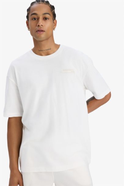 تيشيرت اوفر سايز رياضي مطبوع برقبة مستديرة بيج فاتح من DeFactoFit