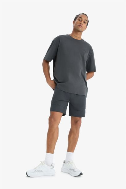 Спортивные шорты DeFactoFit стандартного кроя с завязками и карманами