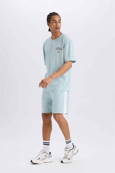 DeFactoFit شورت قصير رياضي قصة عادية مطبوع بجيب من