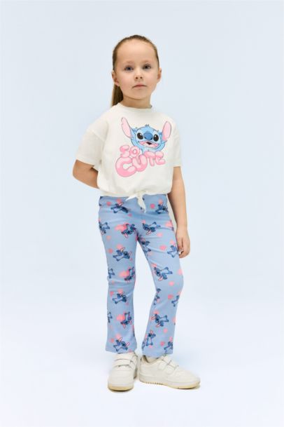 طقم من تيشيرت بنات بطبعة ستيتش و سروال ضيق