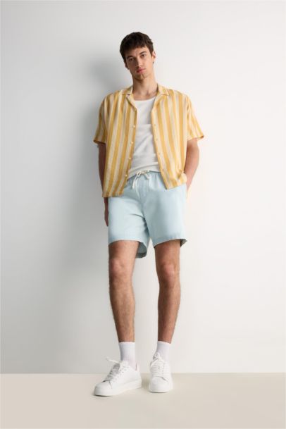 قميص مخطط نص ردن قصة عادية بياخة عالية