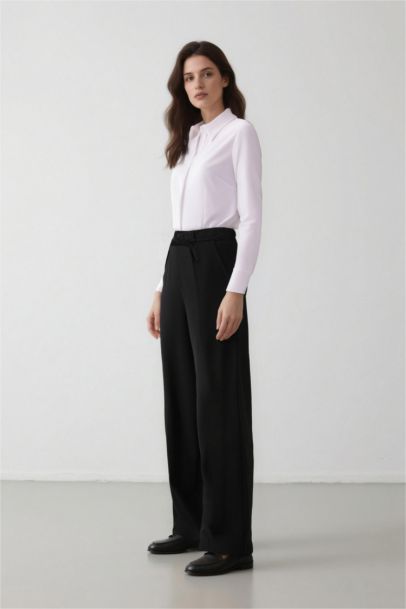 بنطرون قماش وايد ليج برجل واسع بثلاثة جيوب وخصر عادي