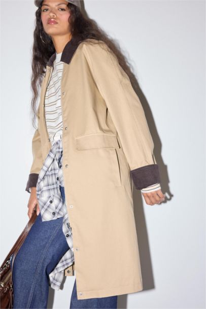 معطف ترانش كوت قصة عادية بياقة بولو