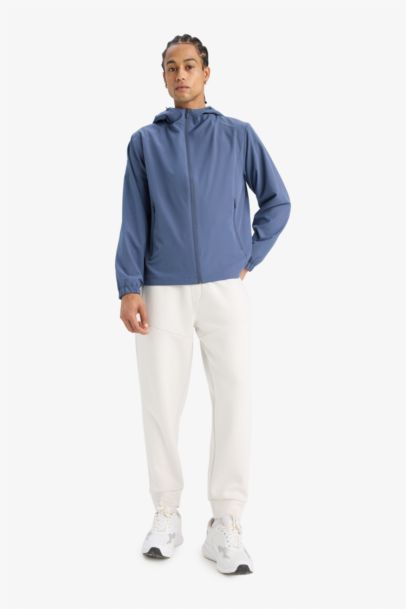 جاكيت مطر قصة عادية بغطاء للرأس مقاوم للماء من DeFactoFit