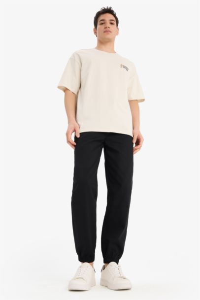 تيشيرت قطن أوفر سايز مطبوع برقبة مستديرة من لوني تونز