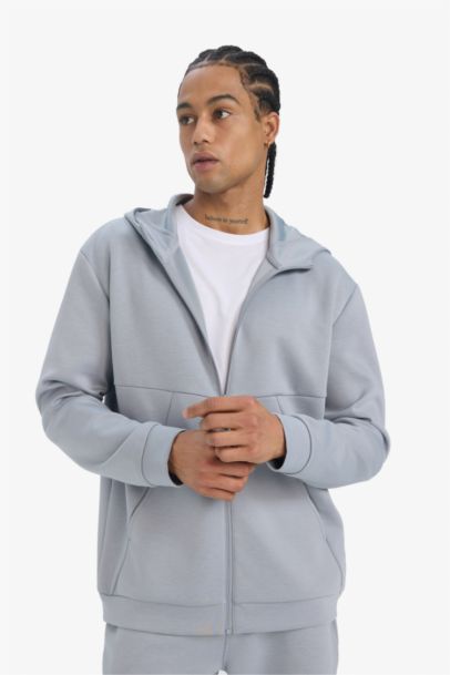 جاكيت رياضي قماش سكوبا قصة عادية بغطاء للرأس من DeFactoFit