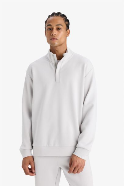 سويت شيرت رياضي قصة عادية بياخة عالية من DeFactoFit