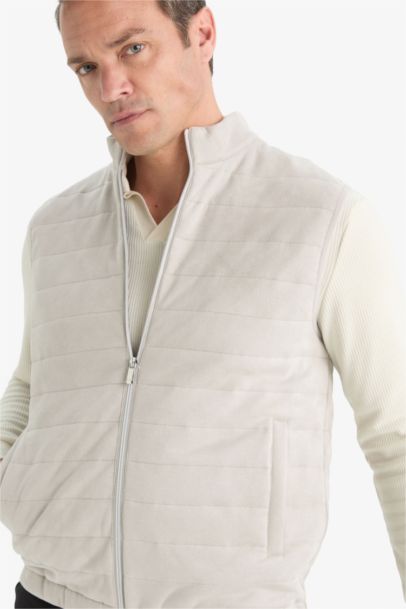 Gilet en suédine mi-saison à col montant zippé avec poches