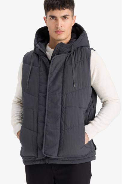 Gilet matelassé à capuche et fermeture zip Coupe régulière