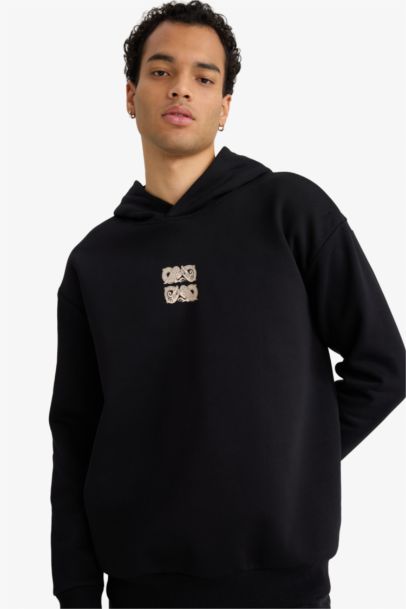 سويت شيرت مطبوع أوفر سايز بغطاء للرأس