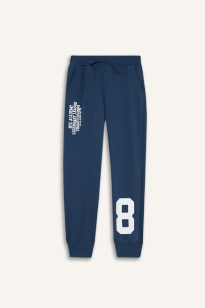 Pantalon de survêtement à taille élastique avec imprimé pour garçon