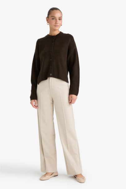 جاكيت تريكو قصة عادية بياخة مستديرة