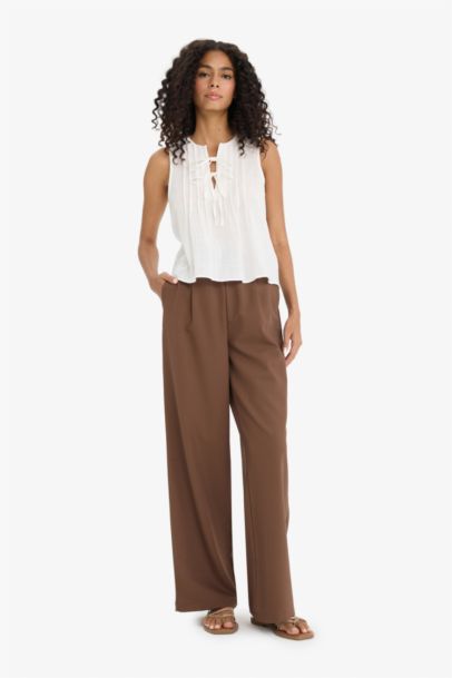 Blouse sans manches à noeuds sur le devant