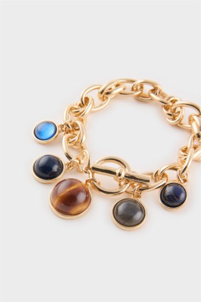 Bracelet doré à pierres colorées pour femme
