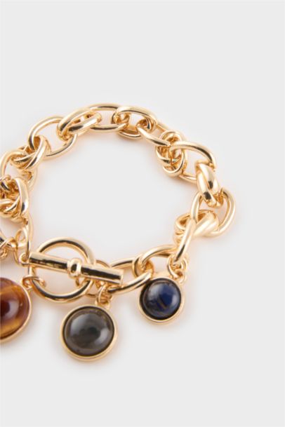 Bracelet doré à pierres colorées pour femme