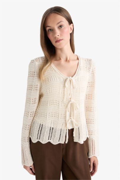 Cardigan ajouré à col V et noeuds sur le devant Coupe régulière