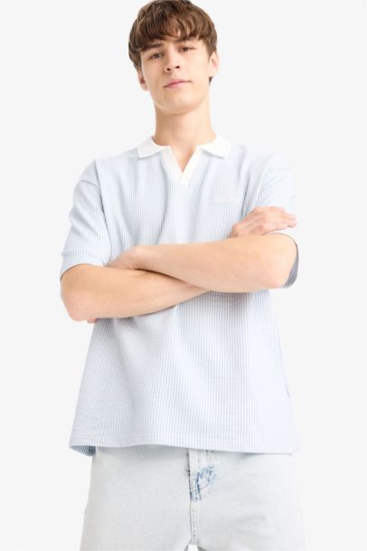 تيشيرت بولو مخطط نص كم اوفر سايز بطبعة شعار