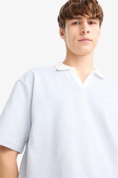 تيشيرت بولو مخطط نص كم اوفر سايز بطبعة شعار