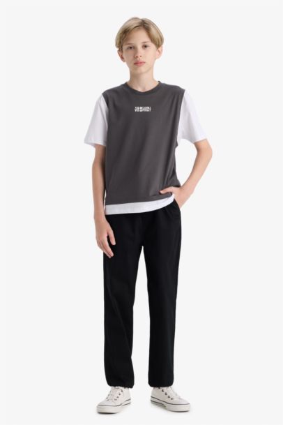 تيشيرت اولادي نص كم بطبعة شعار اوفر سايز