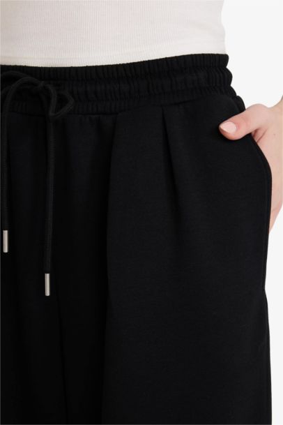 سروال واسع بطيات بخصر مطاطي