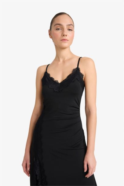 Robe midi à bretelles thème Noël coupe trapèze col V fendue