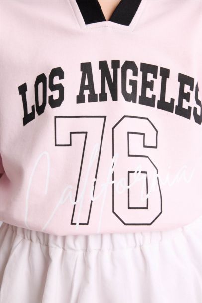 تيشيرت بولو بناتي اوفر سايز بطبعة شعار